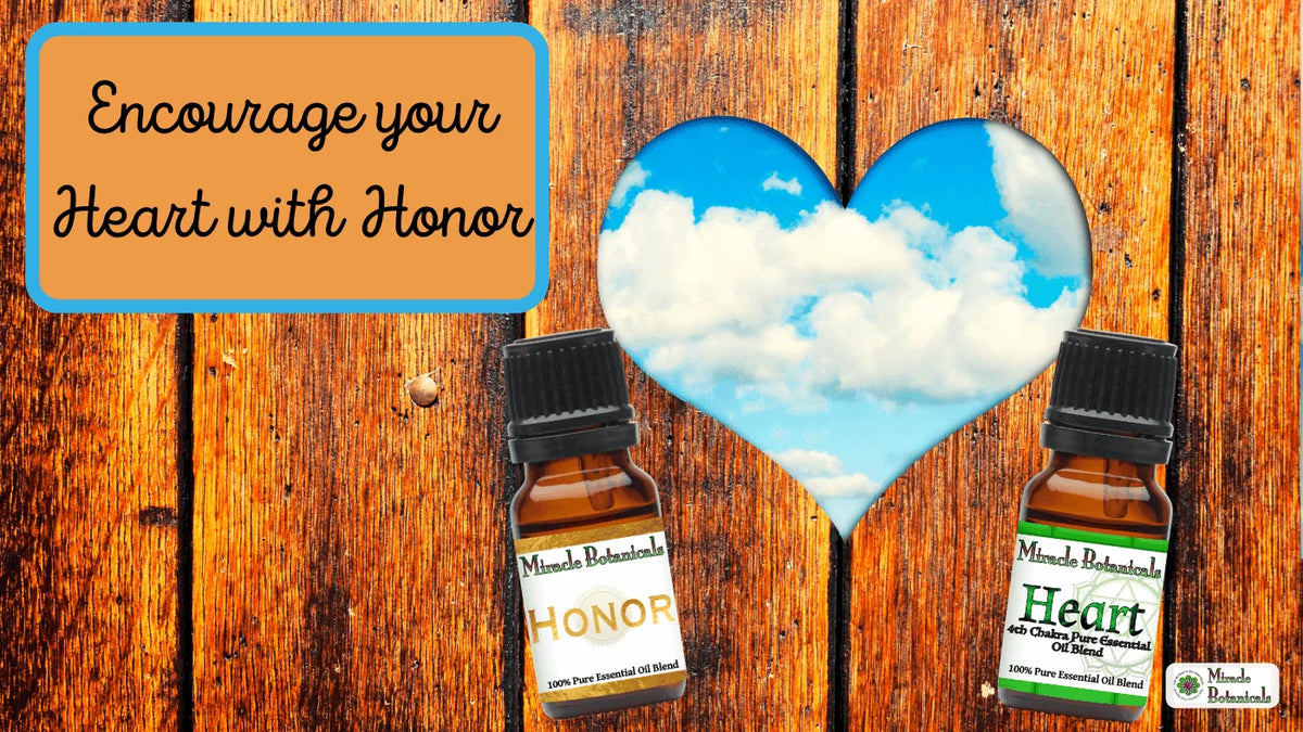 Honor and Heart blend bottles on weathered wood with a heart-shaped cutout of blue sky, with text: Encourage your Heart with Honor