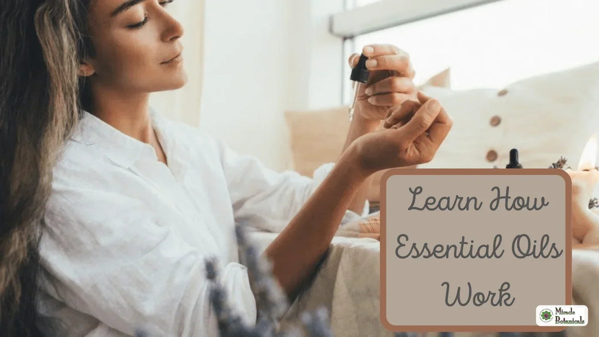 Woman holding a dropper over the inside of her wrist to apply essential oil