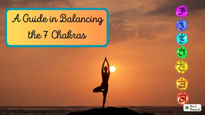 Silhouette in tree pose at sunset beside seven colored chakra symbols, with text: A Guide in Balancing the 7 Chakras