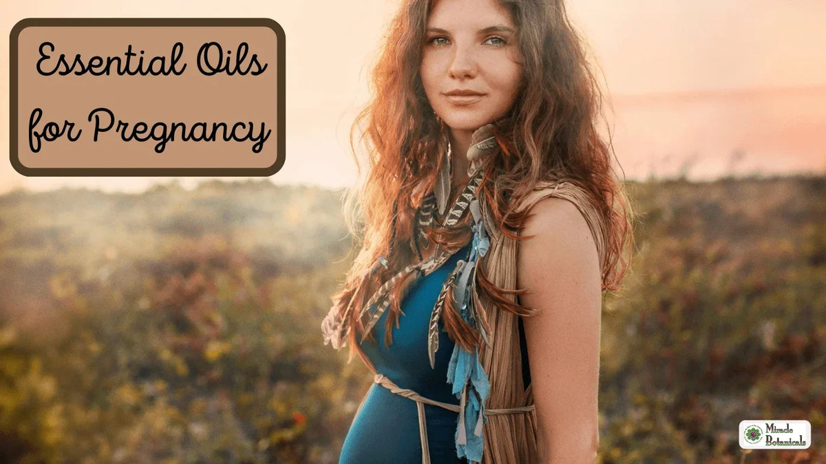 Pregnant woman in a teal dress with feather accessories in a sunlit field, with text: Essential Oils for Pregnancy