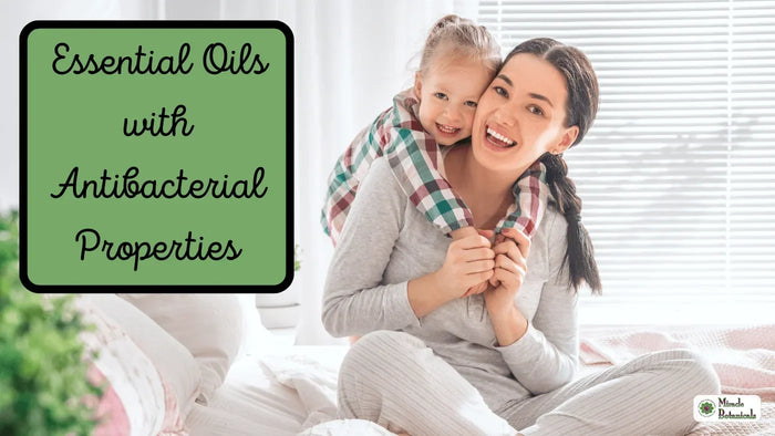 Smiling woman with a young girl hugging her from behind on a bed, with text: Essential Oils with Antibacterial Properties