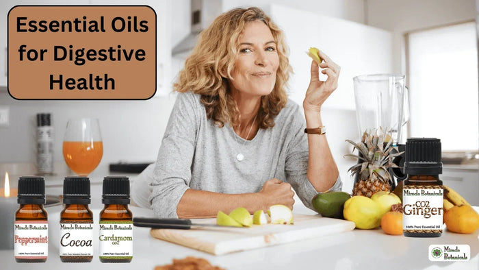 Woman eating fruit in a kitchen with Peppermint, Cocoa, Cardamom CO2 and CO2 Ginger bottles, with text: Essential Oils for Digestive Health