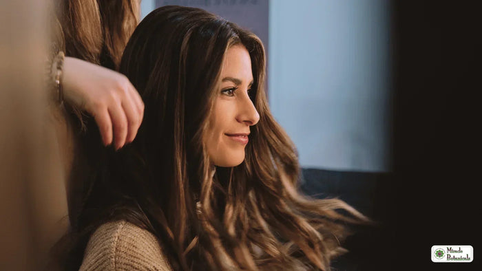 Woman with beautiful long healthy hair showing natural remedies for hair loss