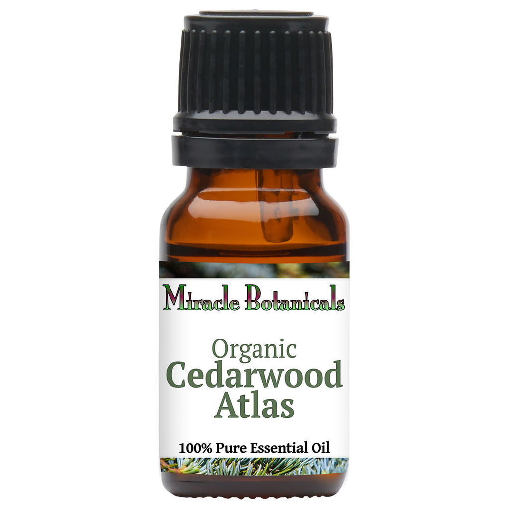 high-quality cedarwood essential oil in dark glass bottle with botanical name Cedrus atlantica